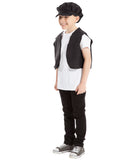 A young boy wearing a black hat, white shirt, black pants, and gray sneakers, smiling and standing against a white background.