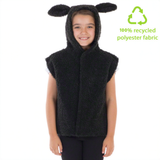 A young girl wearing a black hooded vest with ears, smiling at the camera.